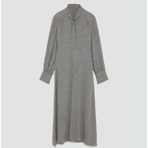 Flowing dress with high collar